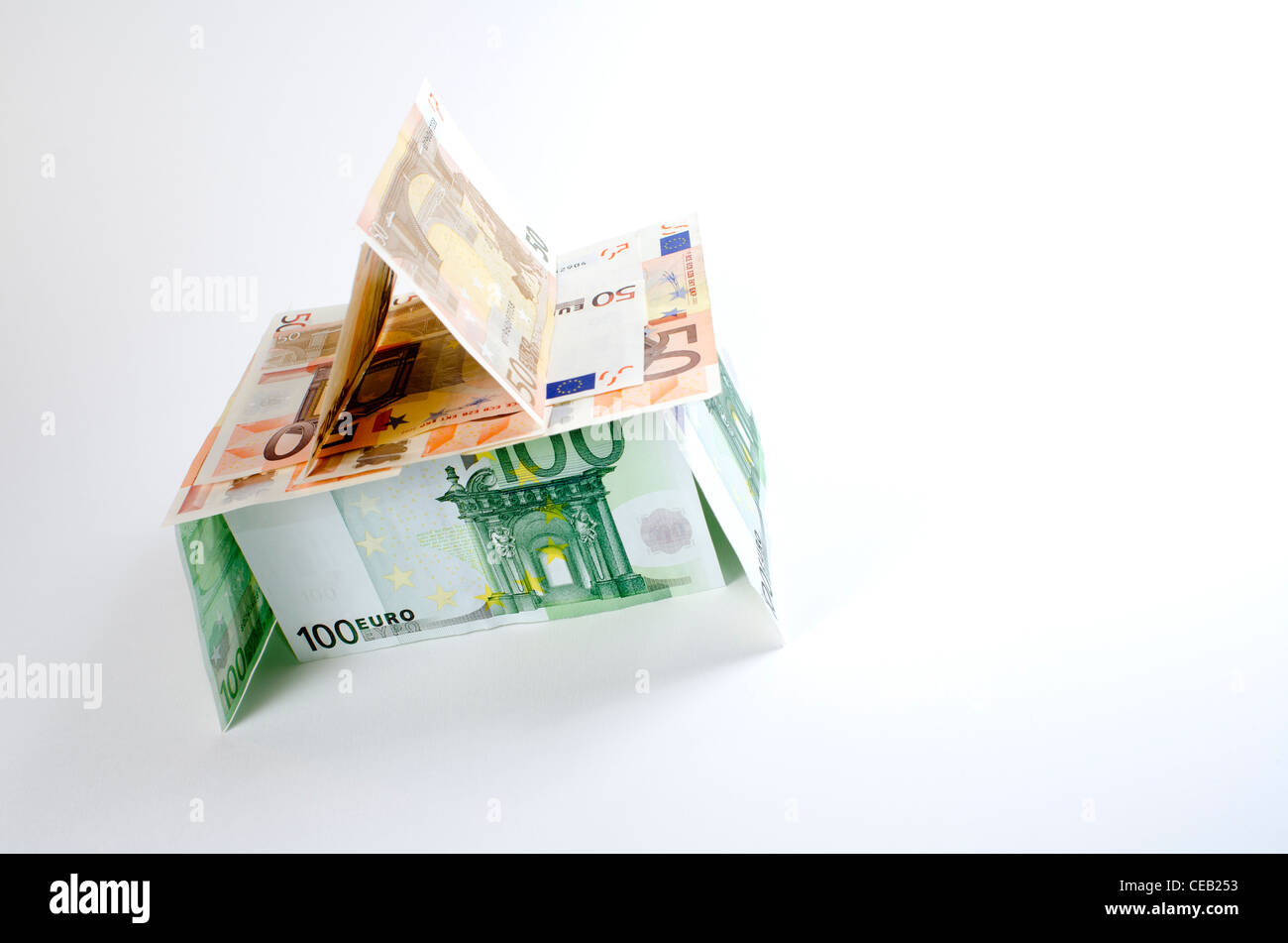 House made of Euro currency portraying the economic crisis and fragility in the eurozone during 2012. Stock Photo