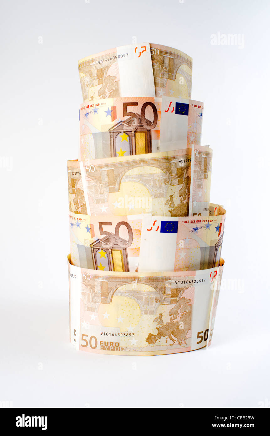Tower made of Euro currency portraying the economic crisis and fragility in the eurozone during 2012 Stock Photo