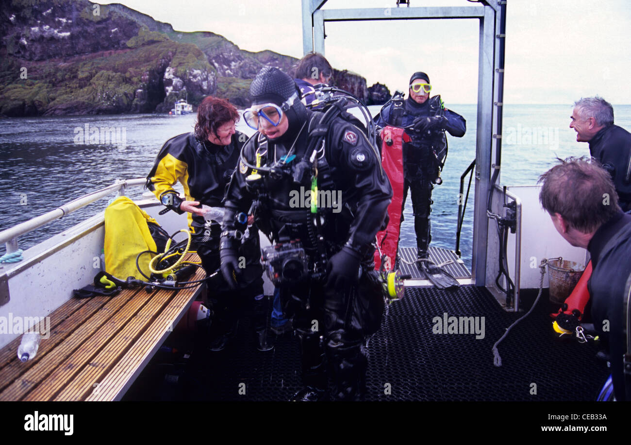 Scuba divers aboard dive boat Wavedancer out of St Abbs. Scotland Stock Photo