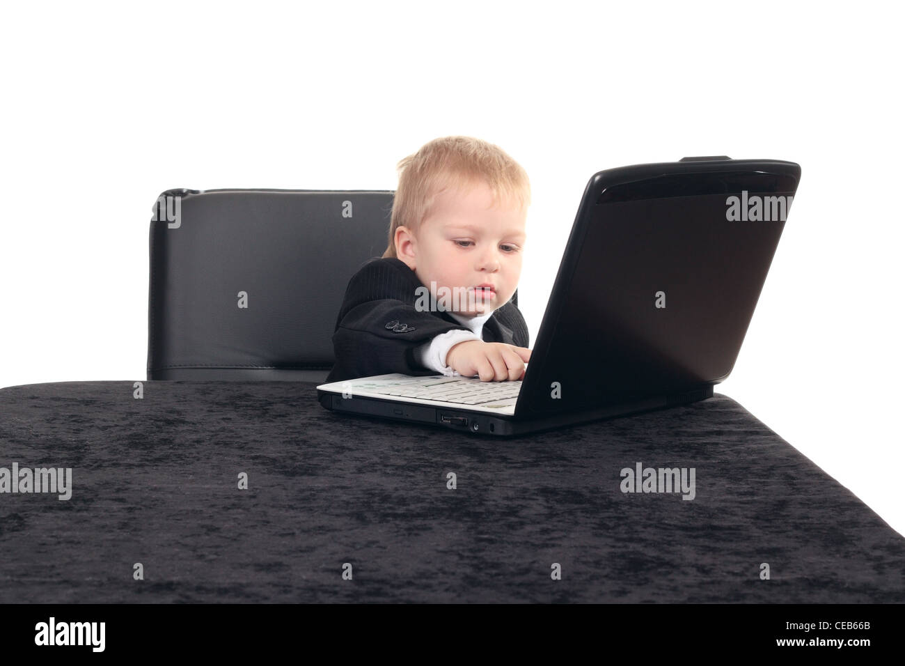 Little businessman working with computer Stock Photo - Alamy