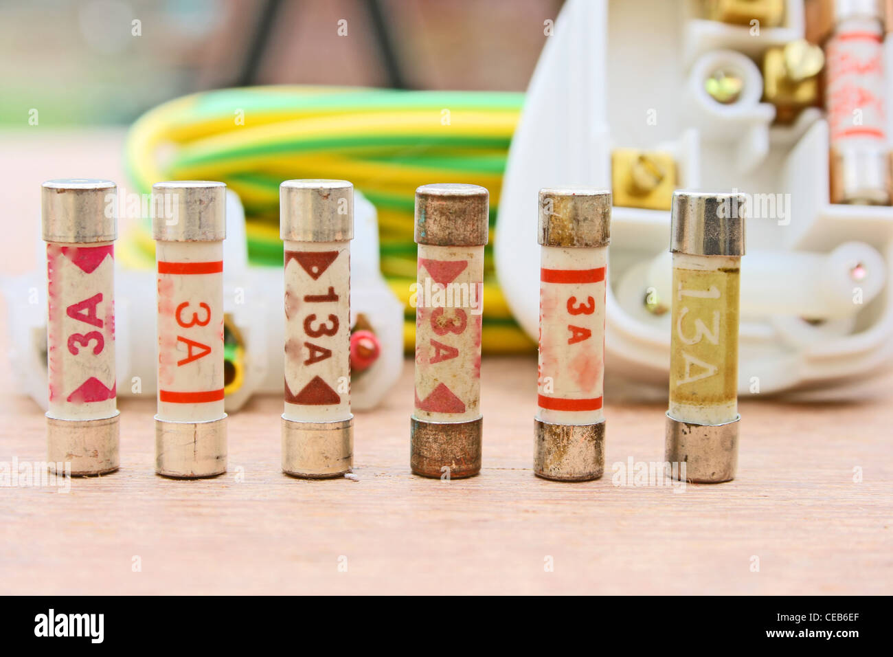 Electrical fuses in front of a three pin plug Stock Photo Alamy