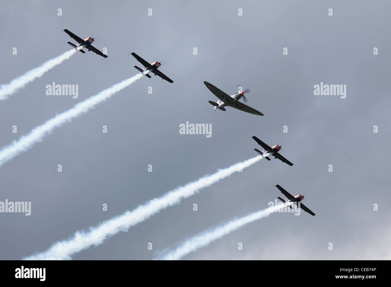 The Blades perform a flypast with a visiting Spitfire, Sywell, Northamptonshire Stock Photo