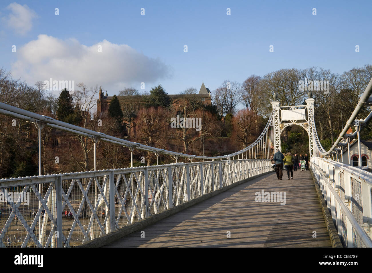 Chester Cheshire View along Queens Park Suspension Bridge over River Dee Stock Photo