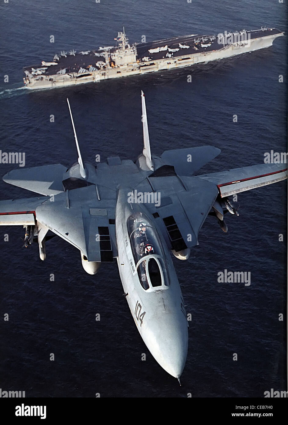 F14 Tomcat flying above Aircraft carrier USS Carl Vinson CVN 70 Stock Photo