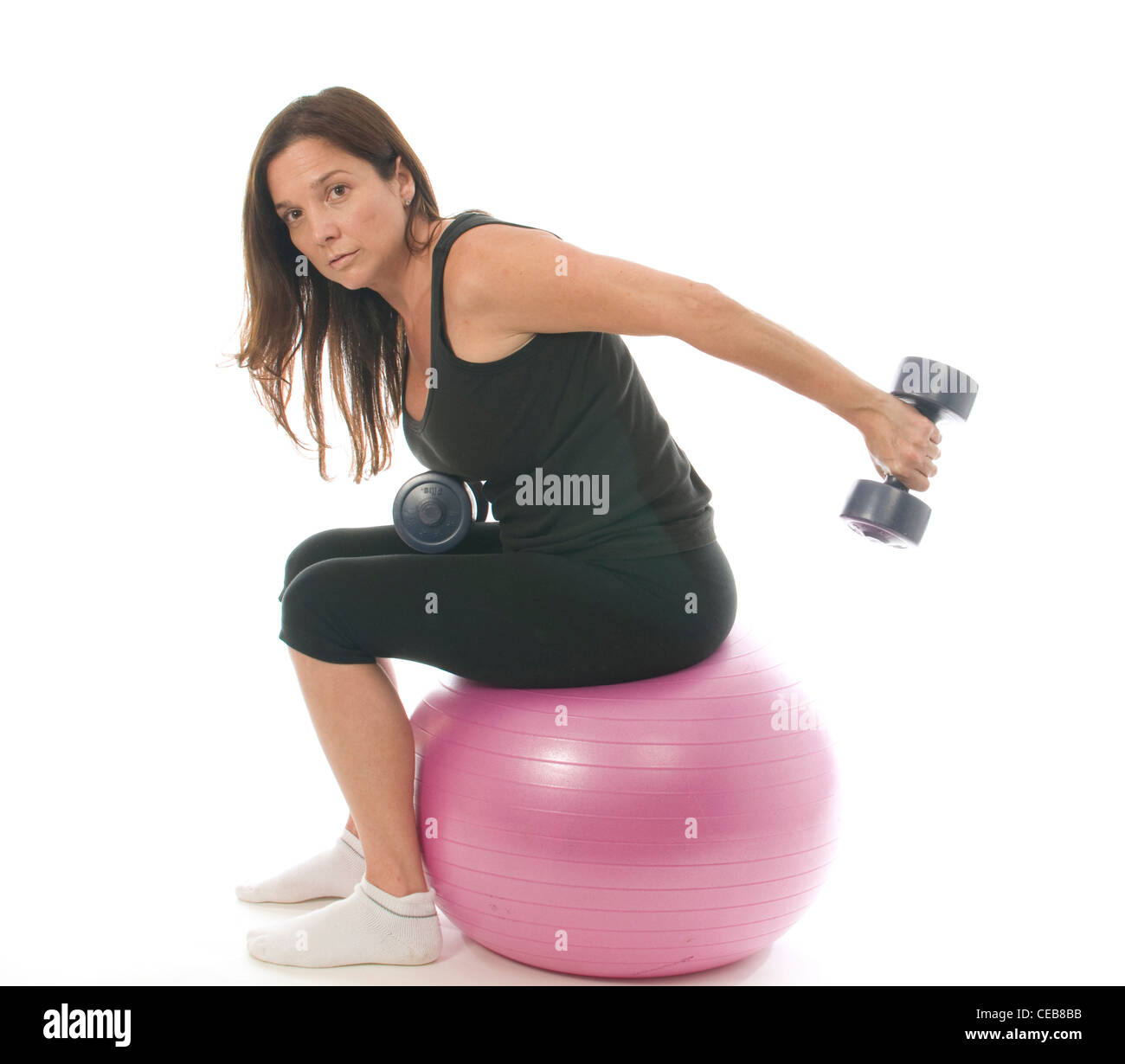 middle age woman fitness exercising strength training with dumbbell