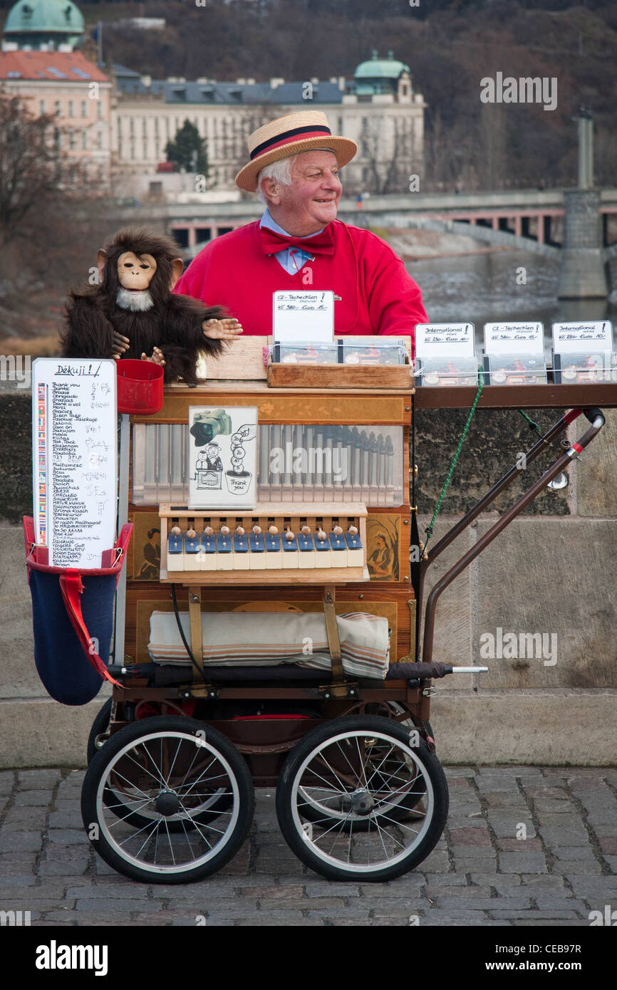 Barrel organ player on the Charles Bridge, Prague Stock Photo