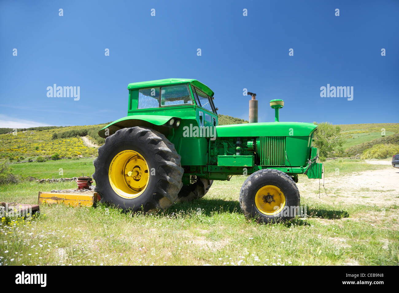 old green tractor at Gredos mountains in Avila Spain Stock Photo - Alamy