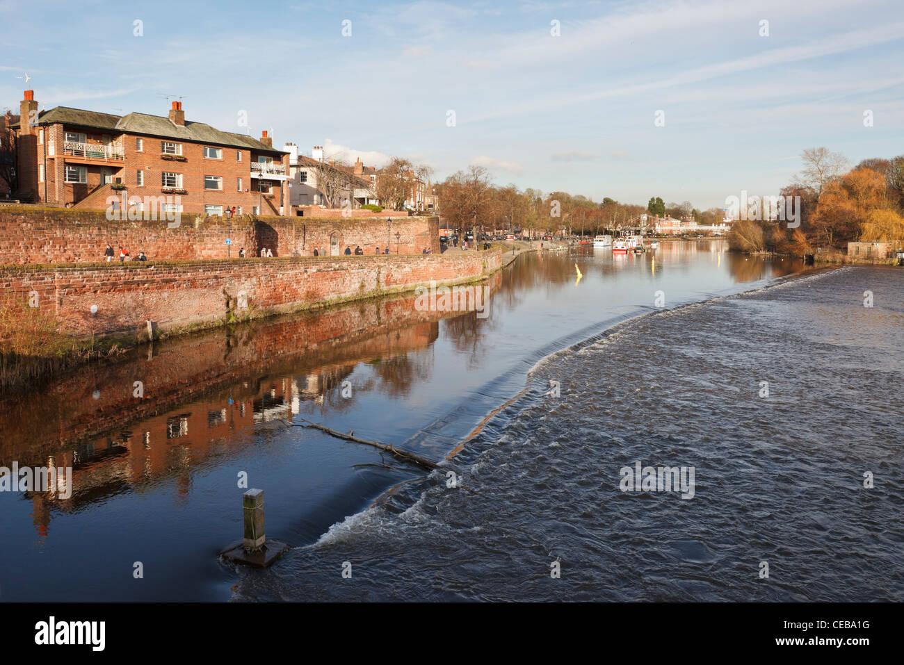 Chester, Cheshire, England, UK. View upstream across the weir on the River Dee to The Groves Stock Photo