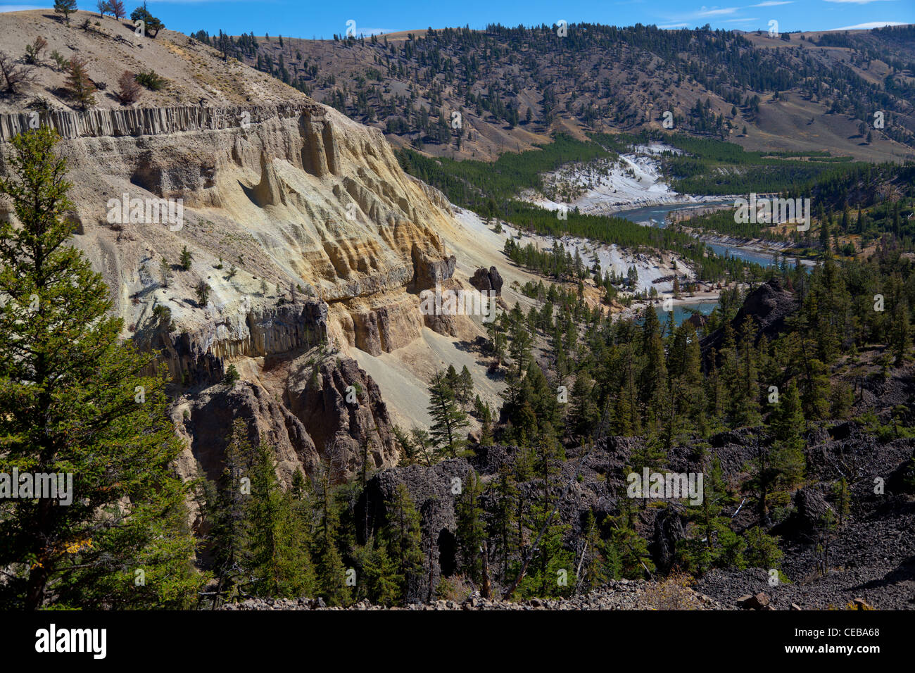 The Narrows of the Yellowstone are located just north of Tower Fall along the Grand Loop Road.  The layers in the cliff face are from basaltic flows occuring at two different times, separated by fluvial deposits. Stock Photo