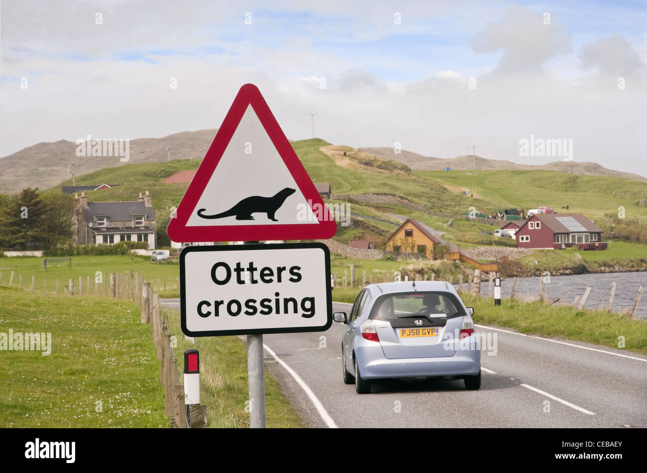 Whiteness, Shetland Islands, Scotland, UK. Road sign warning otters crossing on a main road near a sea loch on the coast Stock Photo