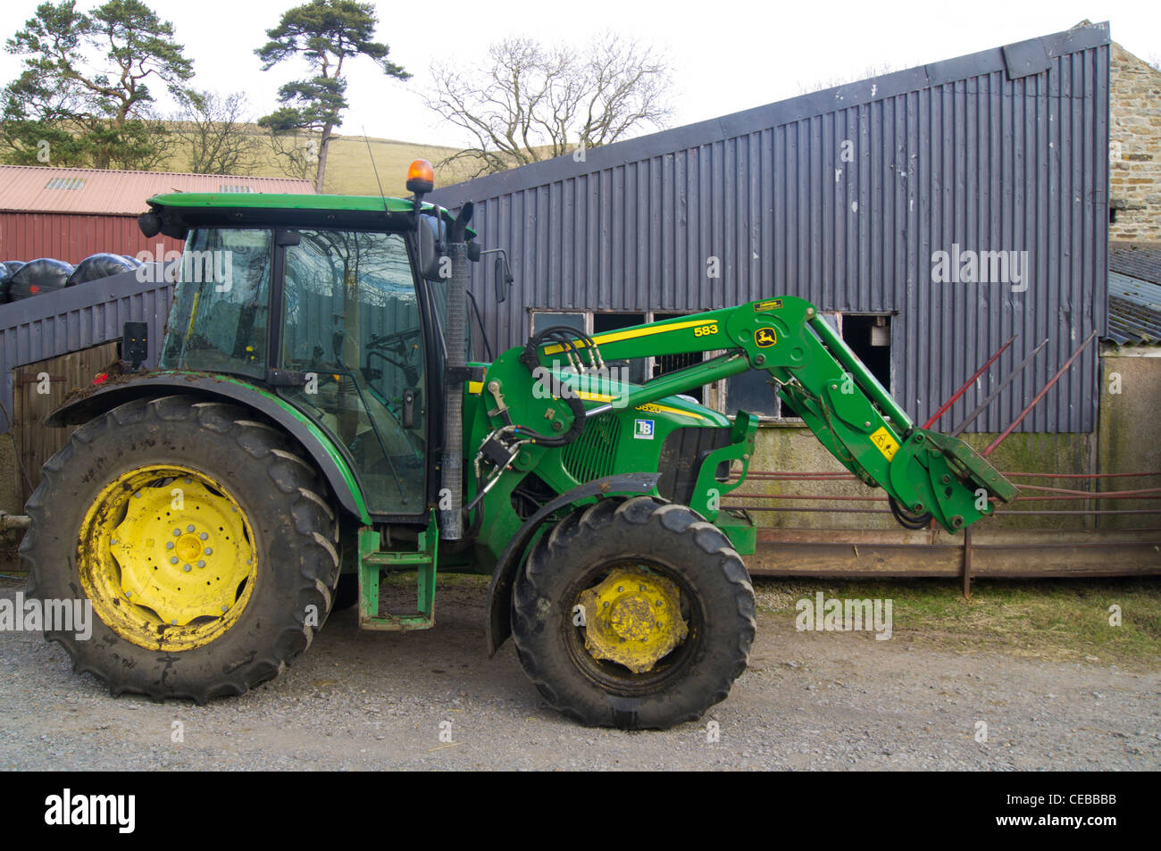 Tractor in a farmyard Stock Photo