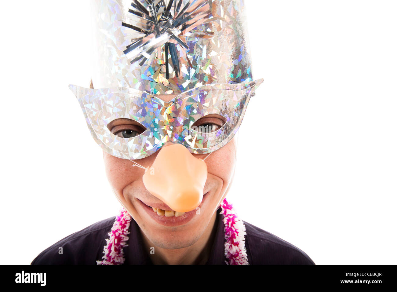 Funny ugly man wearing party mask smiling, isolated on white background. Stock Photo