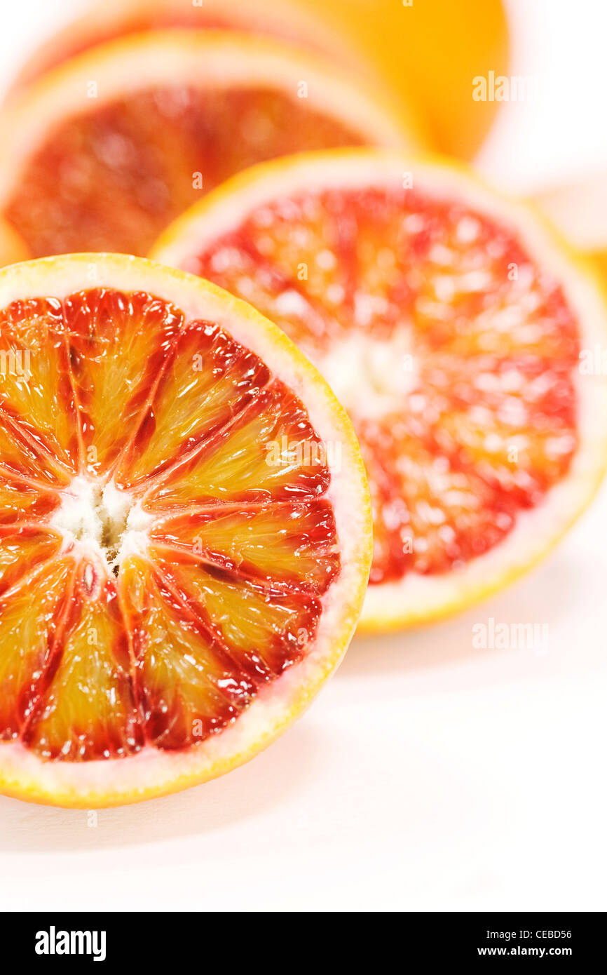 Citrus x sinenesis. Blood Orange halves on a white background. Stock Photo