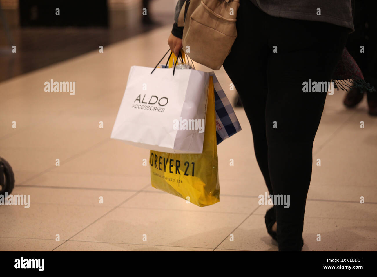 Woman with Aldo and Forever 21 shopping bags in Toronto Eaton Centre Canada  Stock Photo - Alamy