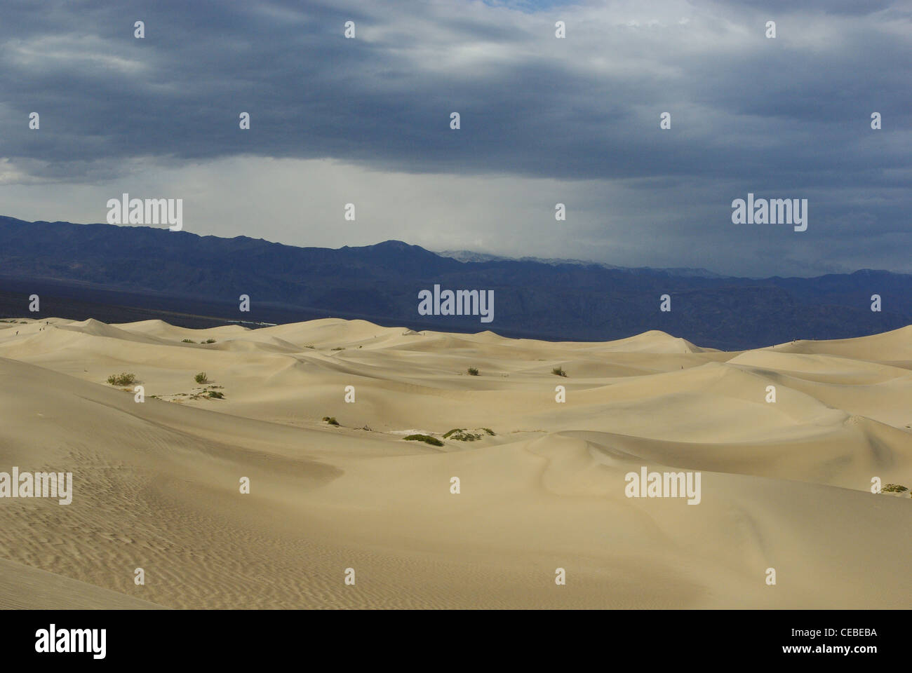 Wide cloudy mountain ranges and dunes, Death Valley, California Stock ...
