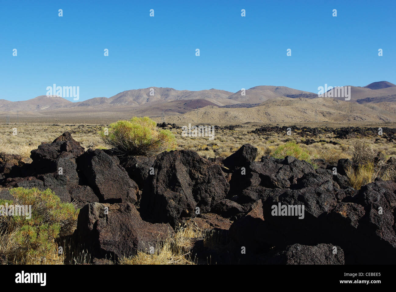 Black Rocks California Black rocks and mountains near South Haiwee Reservoir, California Stock ...