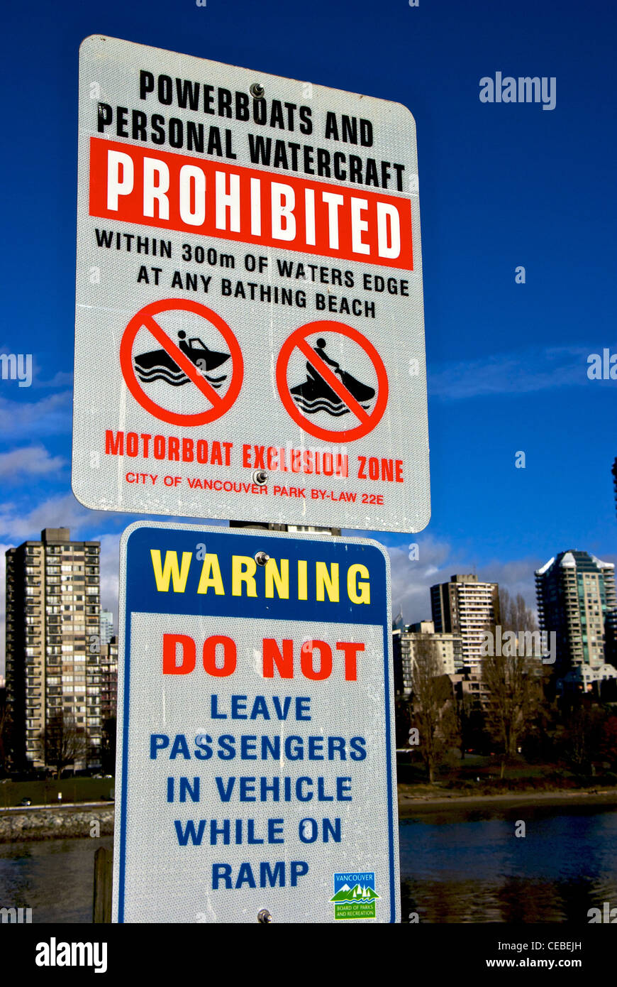 Power boaters warning signs prohibiting powerboats watercraft near swimming beach boat launch ramp dangers Stock Photo