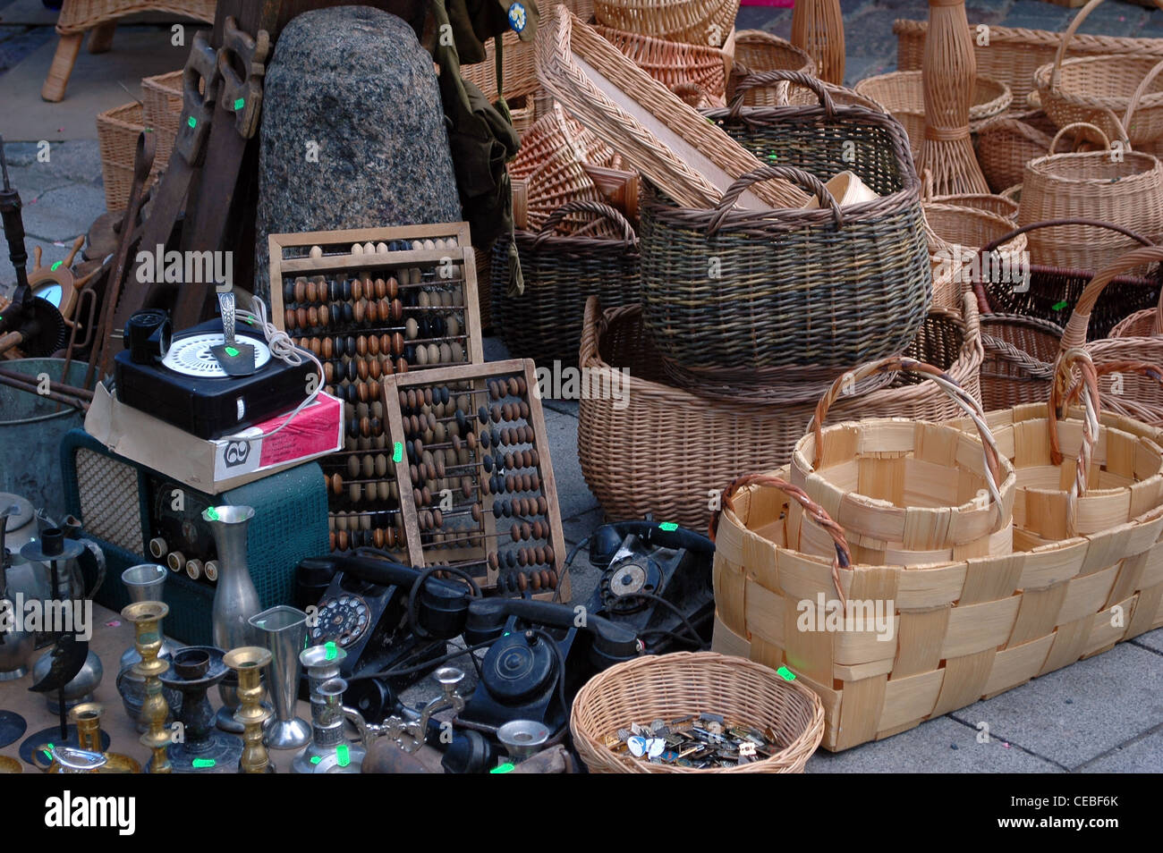 handmade wooden wattled basket in market with other antiques Stock Photo