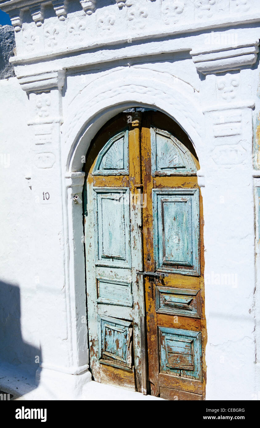 classical entrance with wooden doors on the Greek island of Rhodes Stock Photo