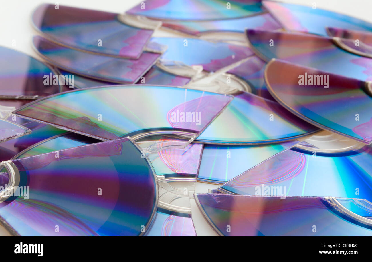 Background of Pieces of Broken CD Compact Discs Stock Photo