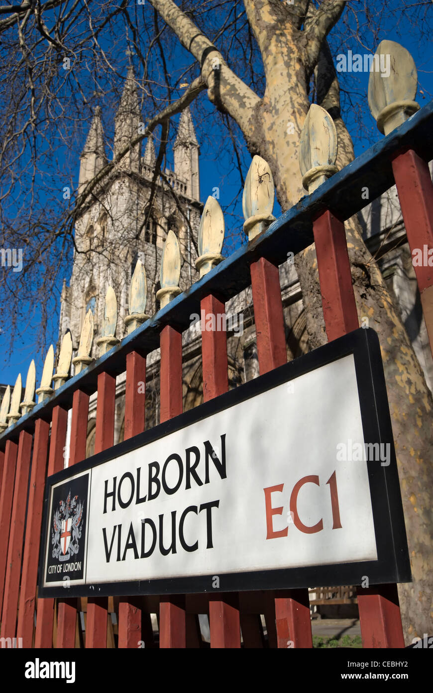 street name sign for holborn viaduct, london, england, the tower of the church of st sepulchre without newgate in background Stock Photo