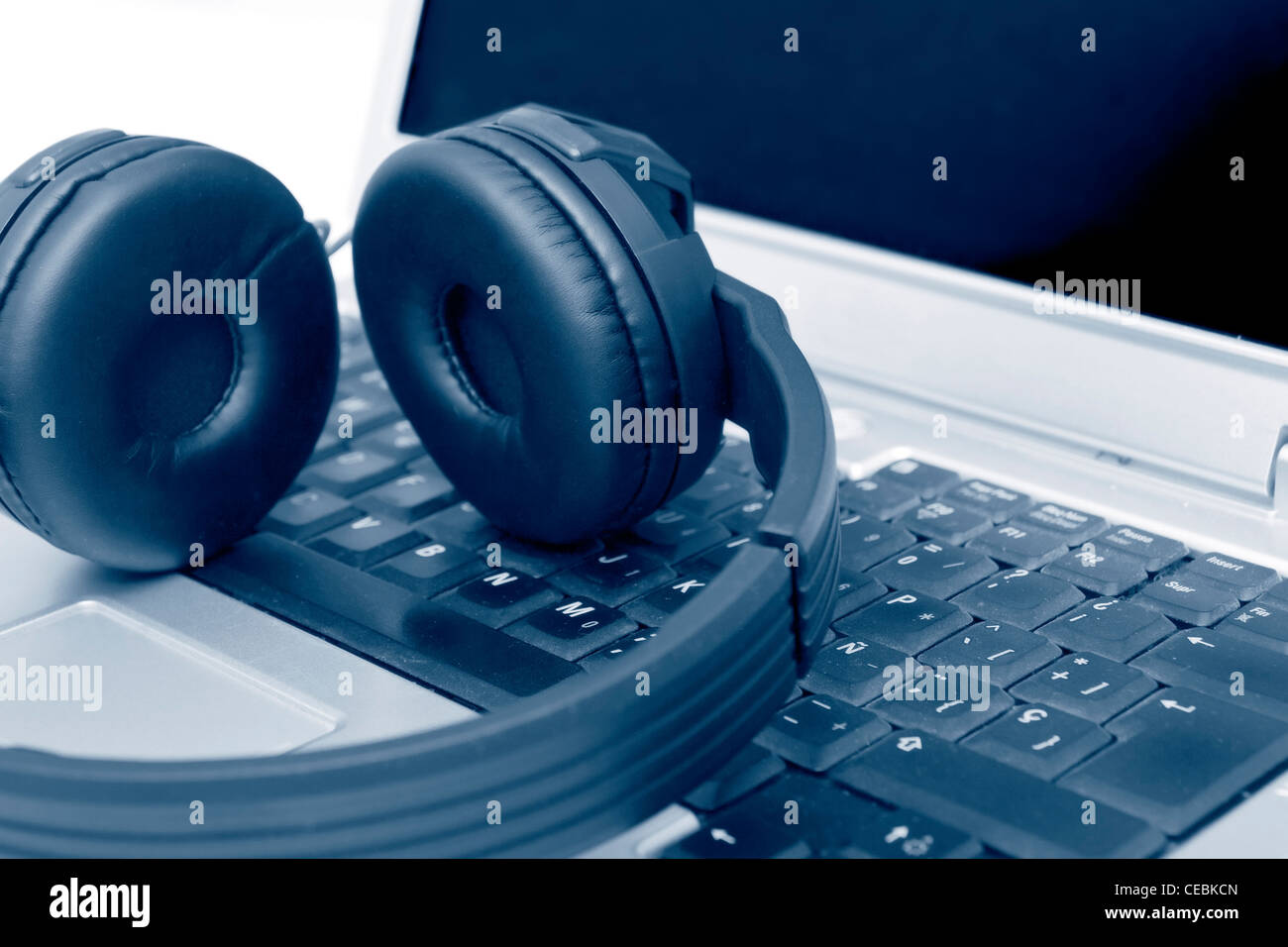 Headphones on Laptop Stock Photo