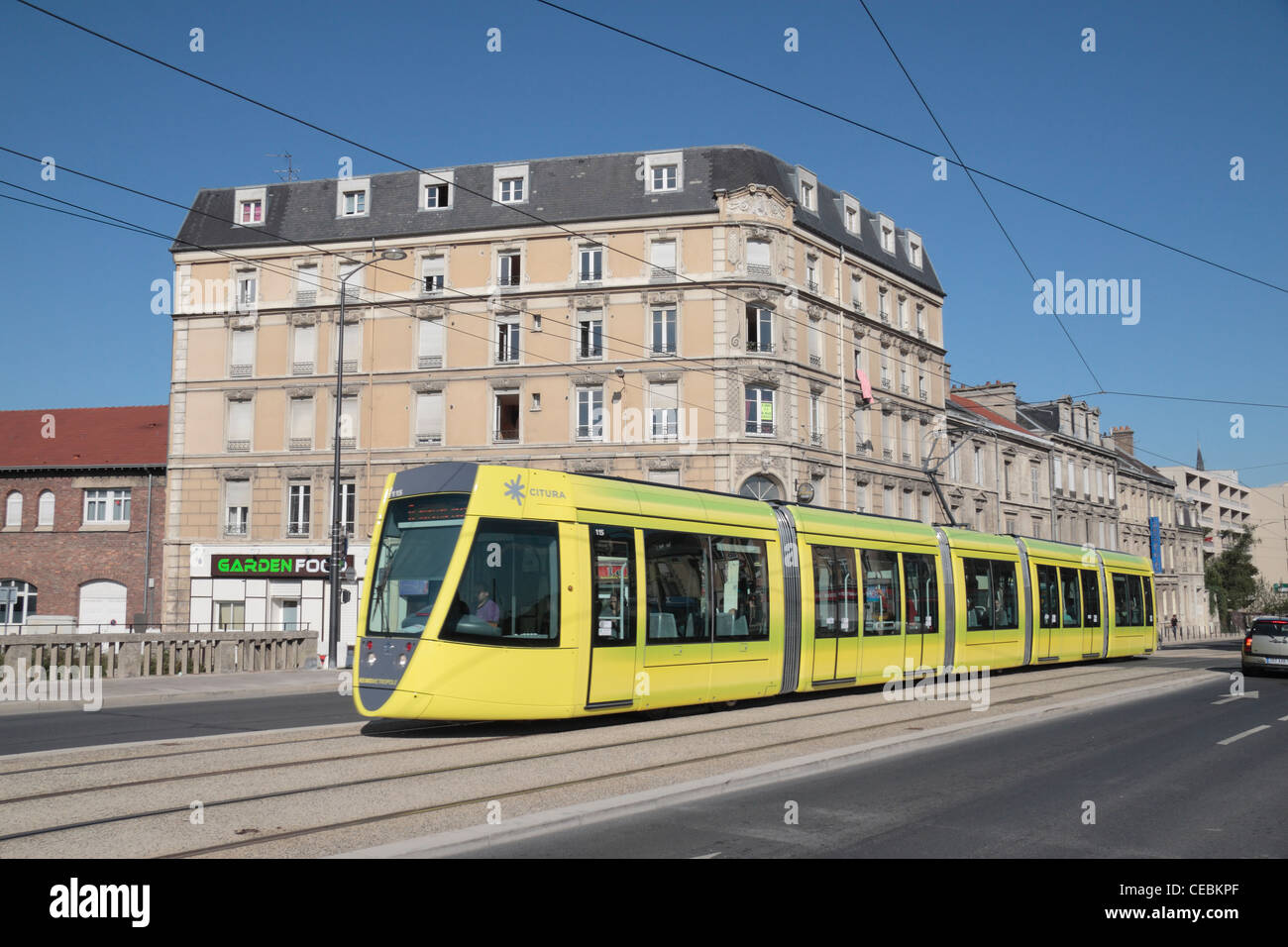 The bright yellow city tram (by Citura) on Av de Laon in Riems, Champagne-Ardenne, France. Stock Photo