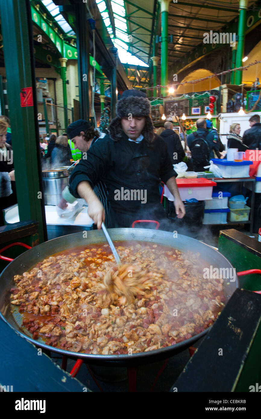 A large paella being prepared, Borough Market, London, UK Stock Photo