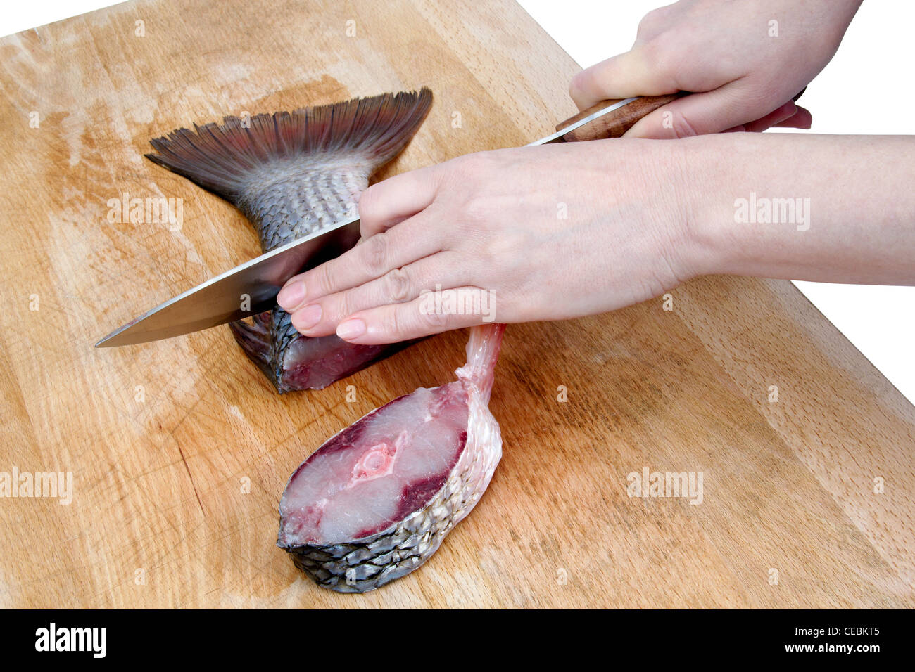Cutting fish, isolated on white background Stock Photo - Alamy