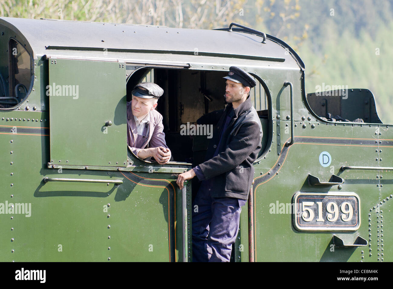 A steam locomotive on the Llangollen Railway with the engine driver and fireman Stock Photo