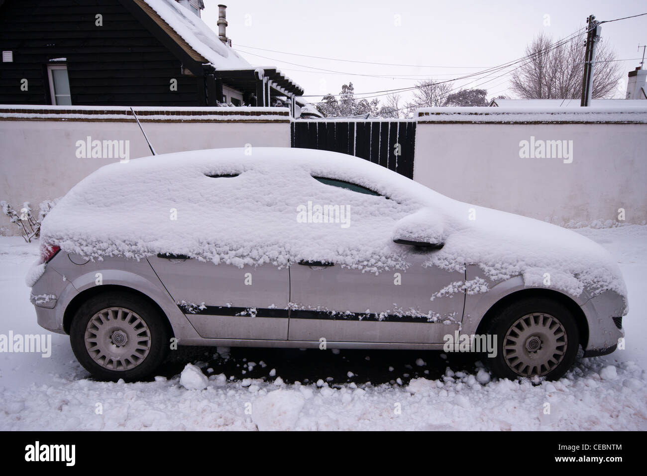 Snow Covered Parked Broken Down Car Vehicle After A Heavy Snowfall Stock Photo