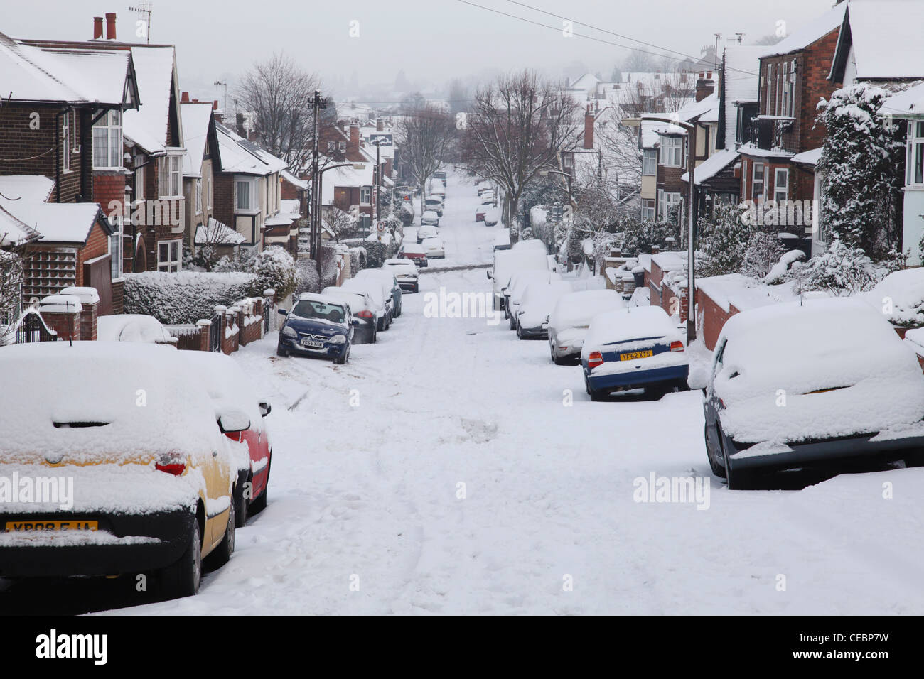 A snow covered suburban road in Nottingham, England, U.K Stock Photo