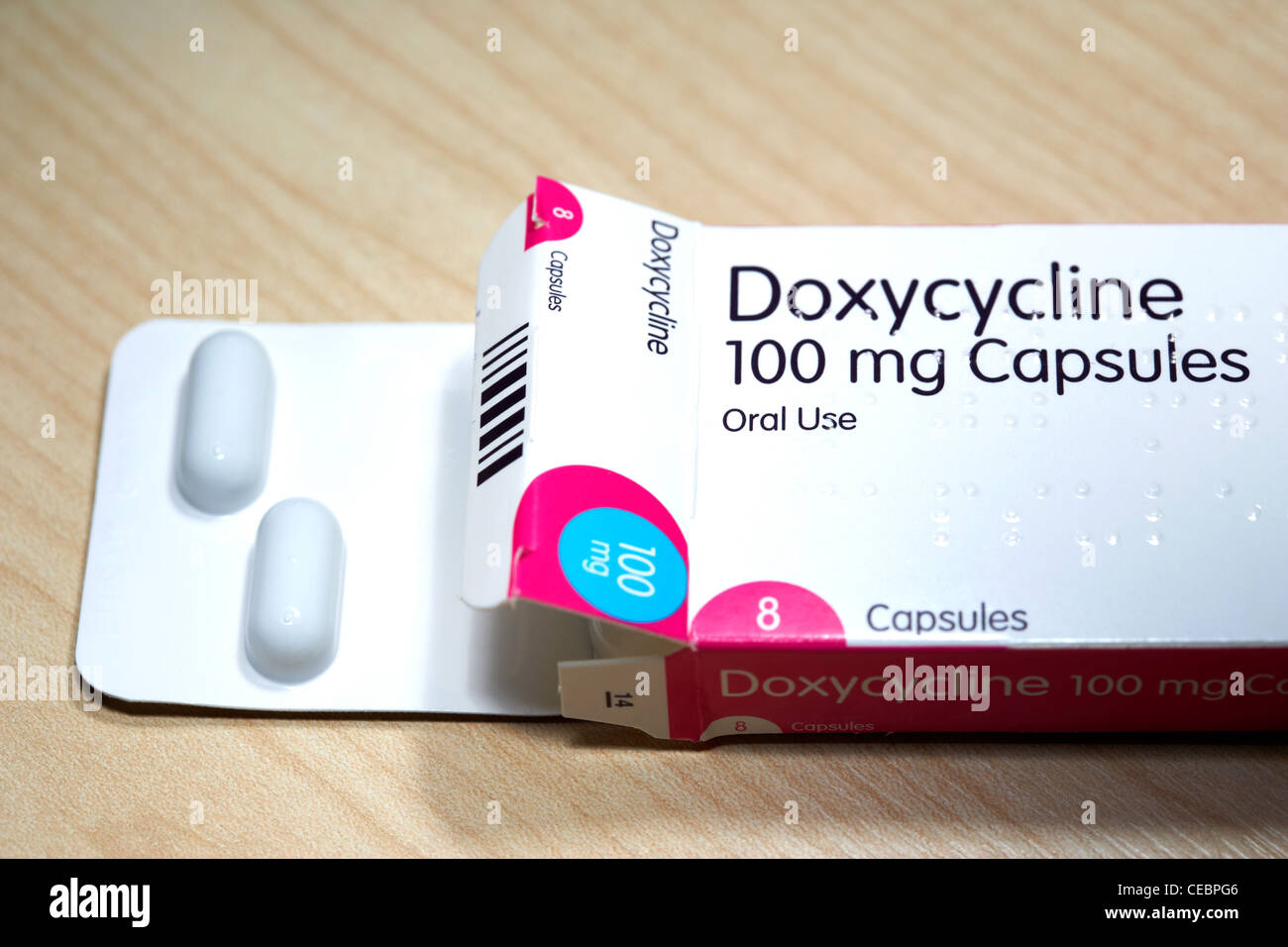 doxycycline 100mg capsules antibiotic in braille encoded box usually prescribed as an anti-malarial or for bacterial infections Stock Photo