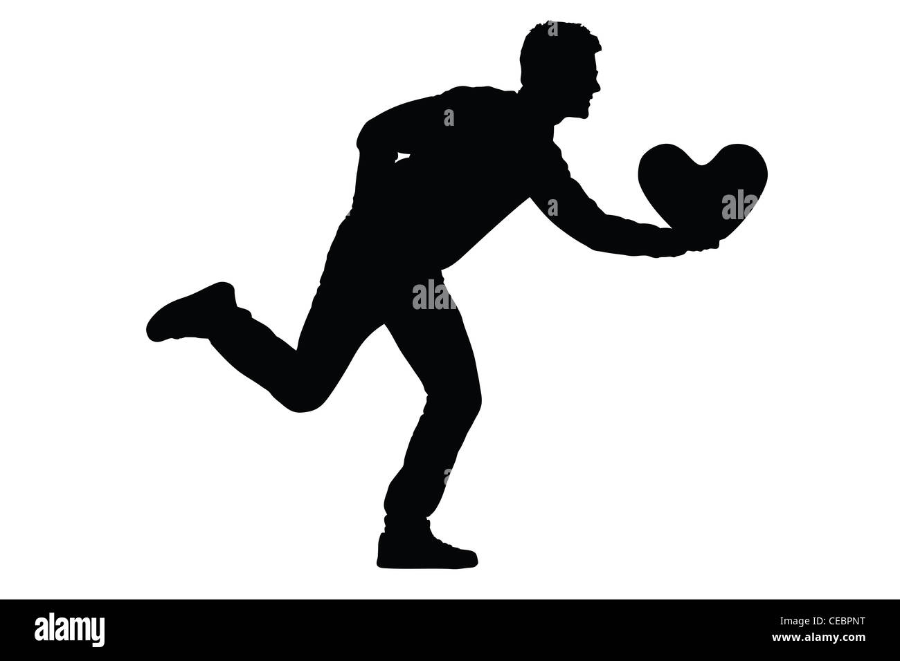 Silhouette of a man running, holding a heart Stock Photo