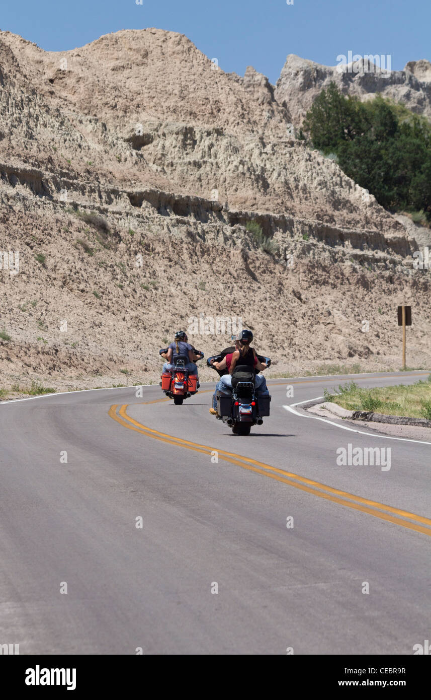 Motorcyclists Rear View American road Badlands National Park South Dakota in USA US two ...