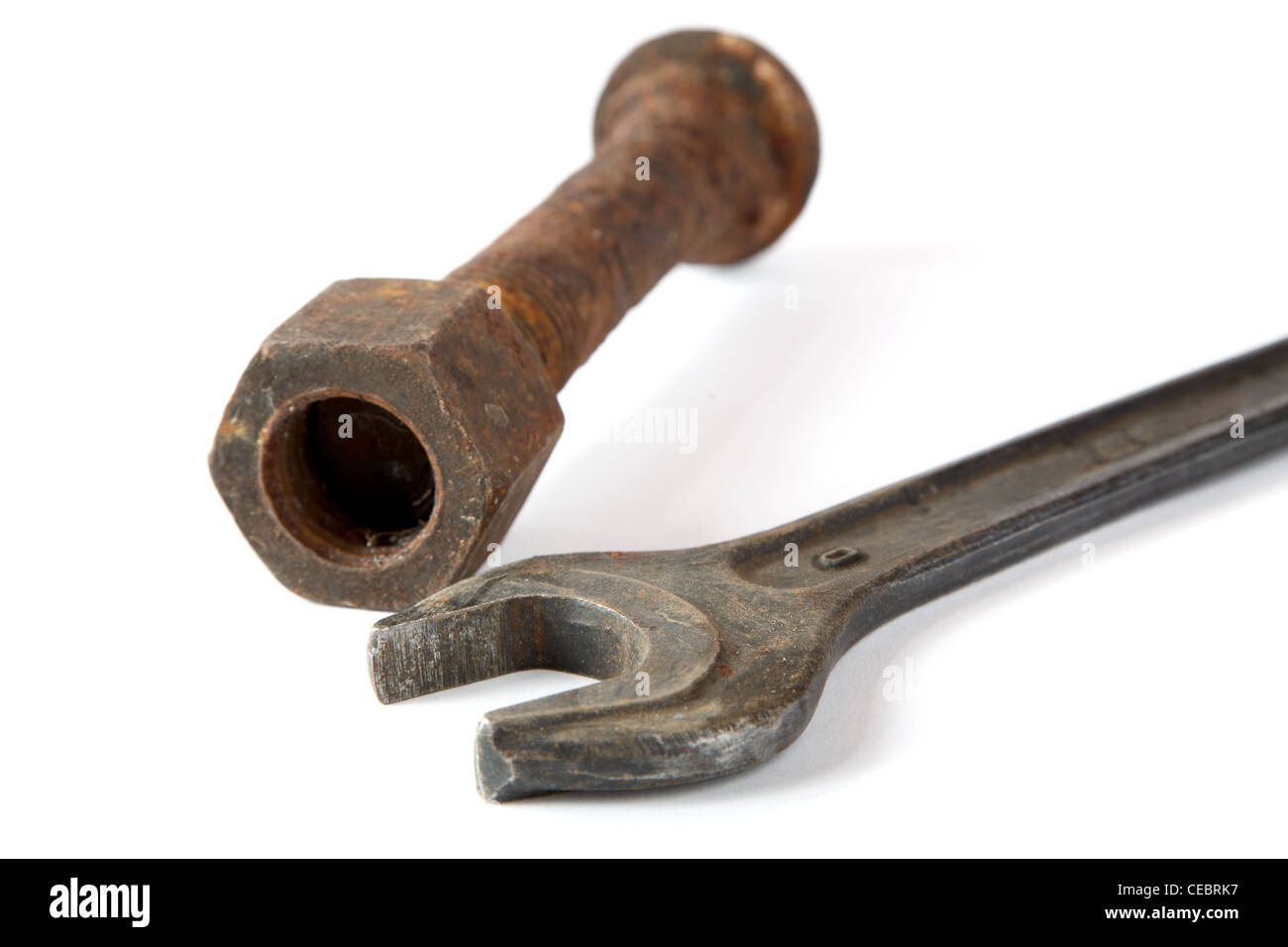 Wrench and rusty bolt with nut on a white background Stock Photo - Alamy