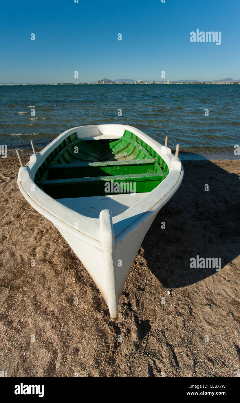 White fishing boat resting on a Mediterranean beach Stock Photo - Alamy