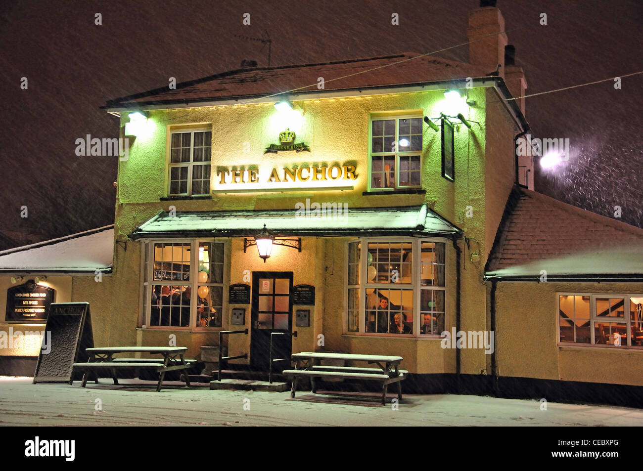 The Anchor Pub in winter snow, Stanwell Moor, Borough of Spelthorne, Surrey, England, United Kingdom Stock Photo