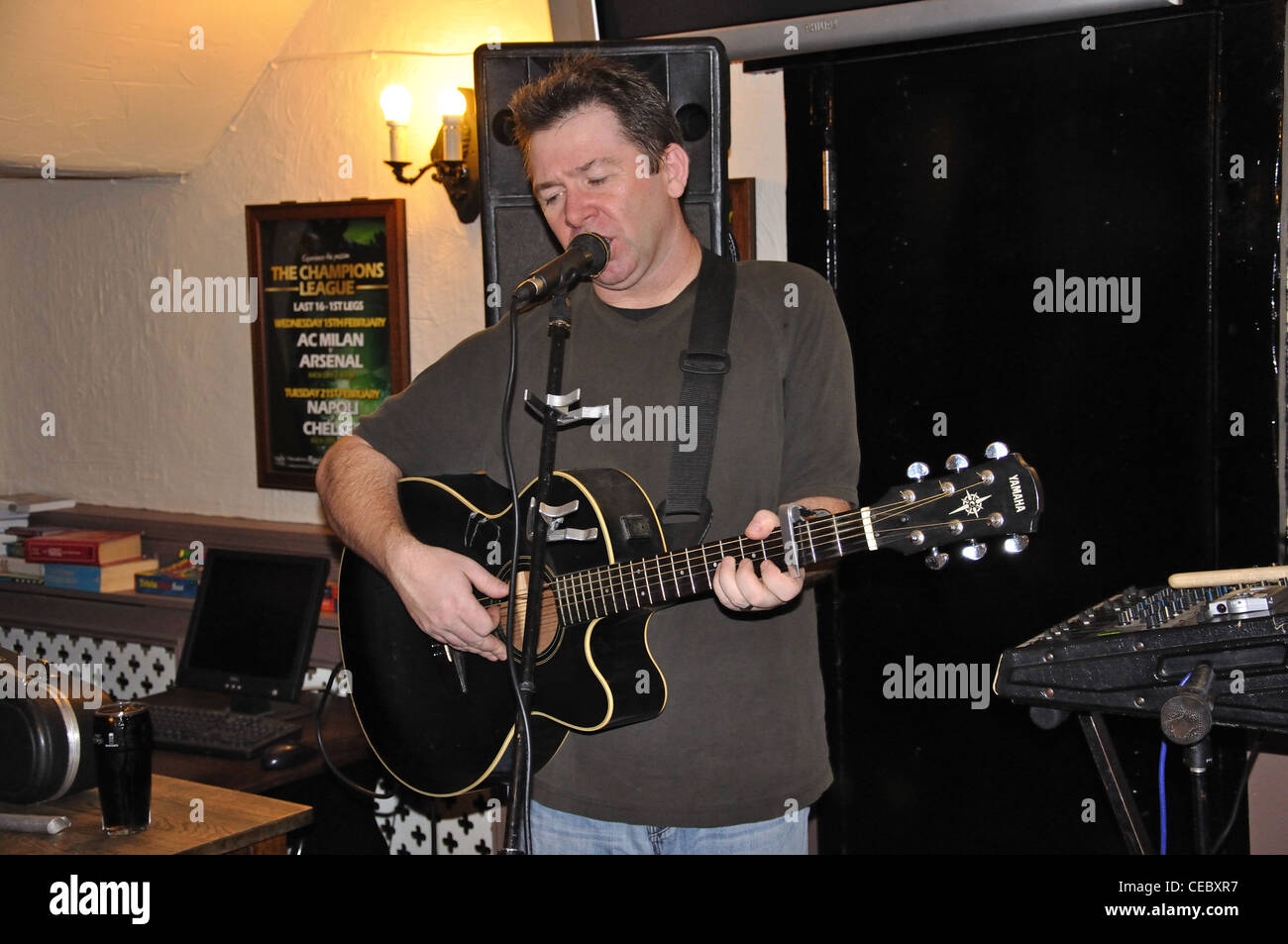Male musician performing in Anchor Pub, Stanwell Moor, Borough of Spelthorne, Surrey, England, United Kingdom Stock Photo