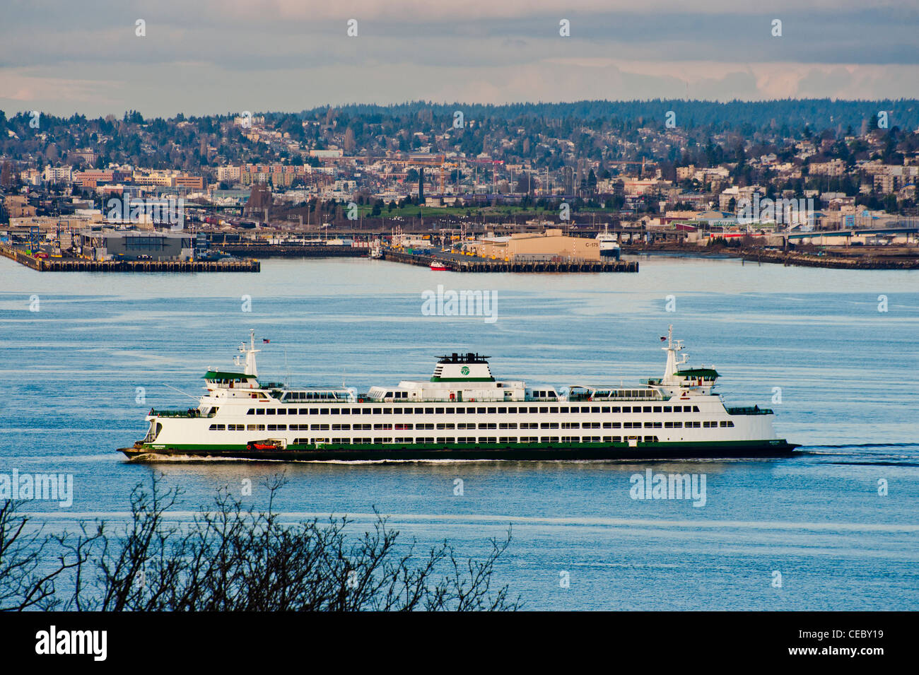 A Seattle to Bainbridge island ferryboat crosses into Elliott Bay and the Seattle waterfront