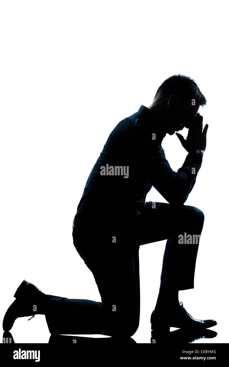 Man kneeling silhouette hi-res stock photography and images - Alamy