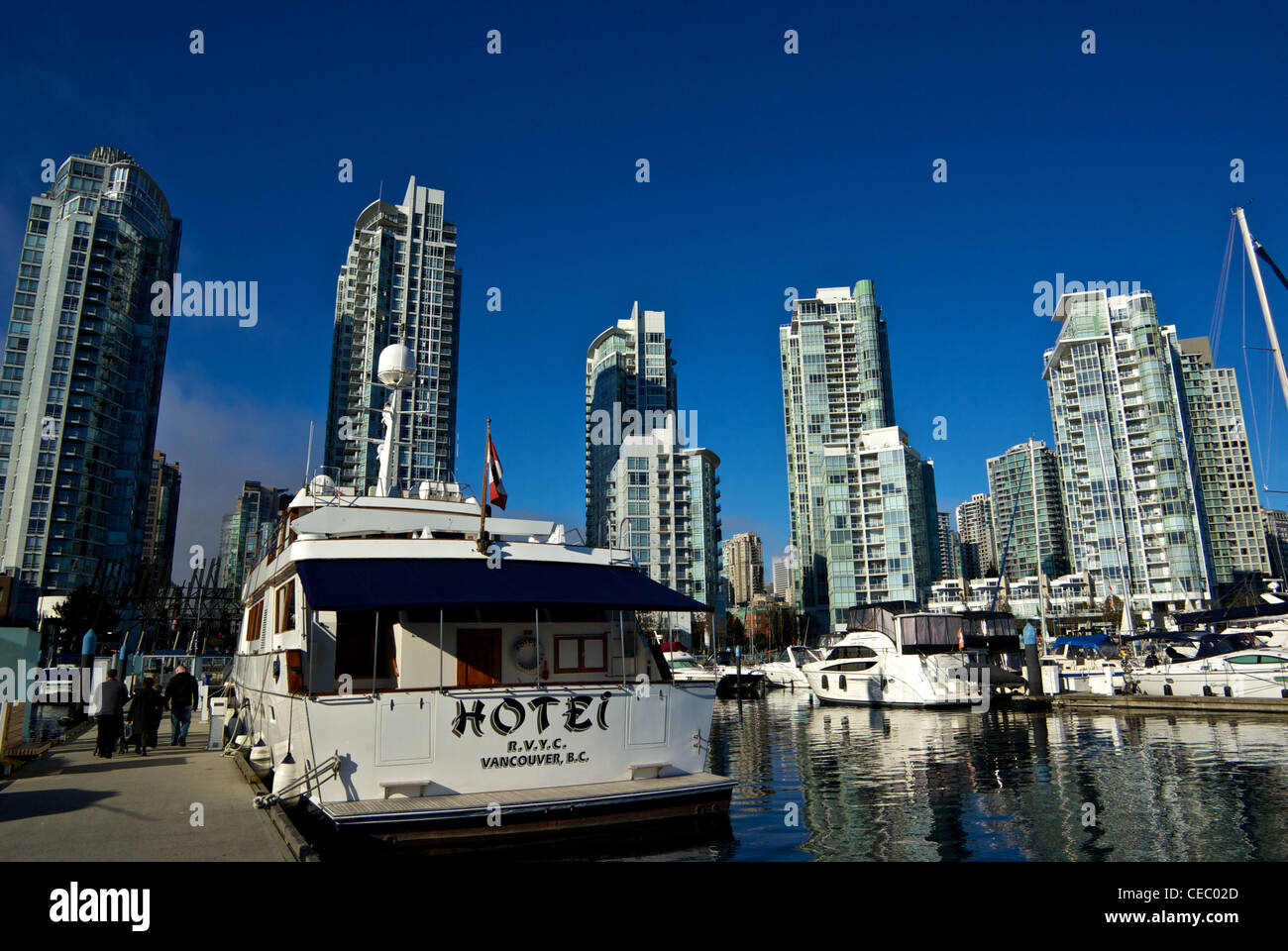 Mega yacht docked Concord Pacific highrise condominium residential development False Creek moorage Stock Photo