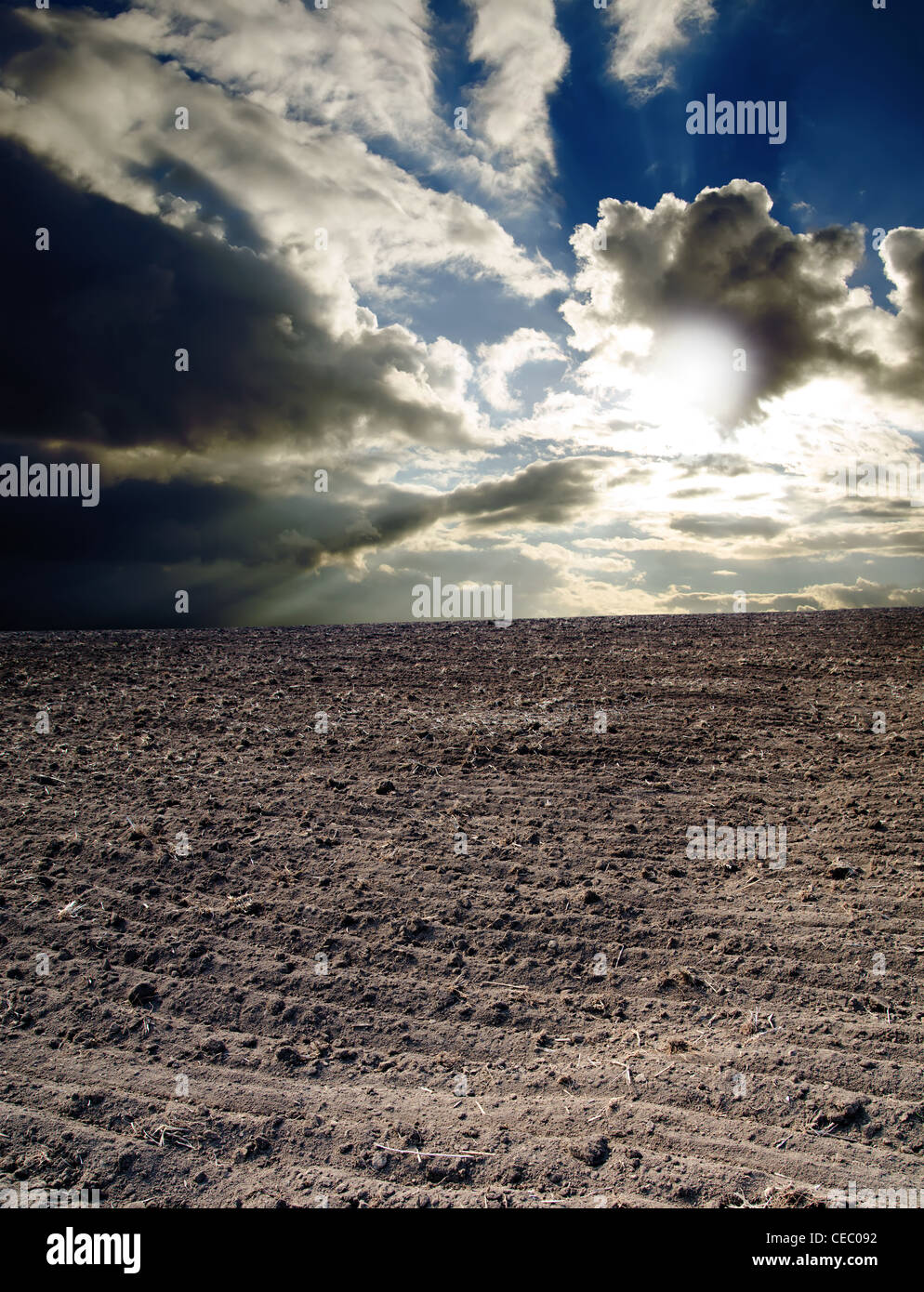 ploughed field under dramatic sky Stock Photo - Alamy