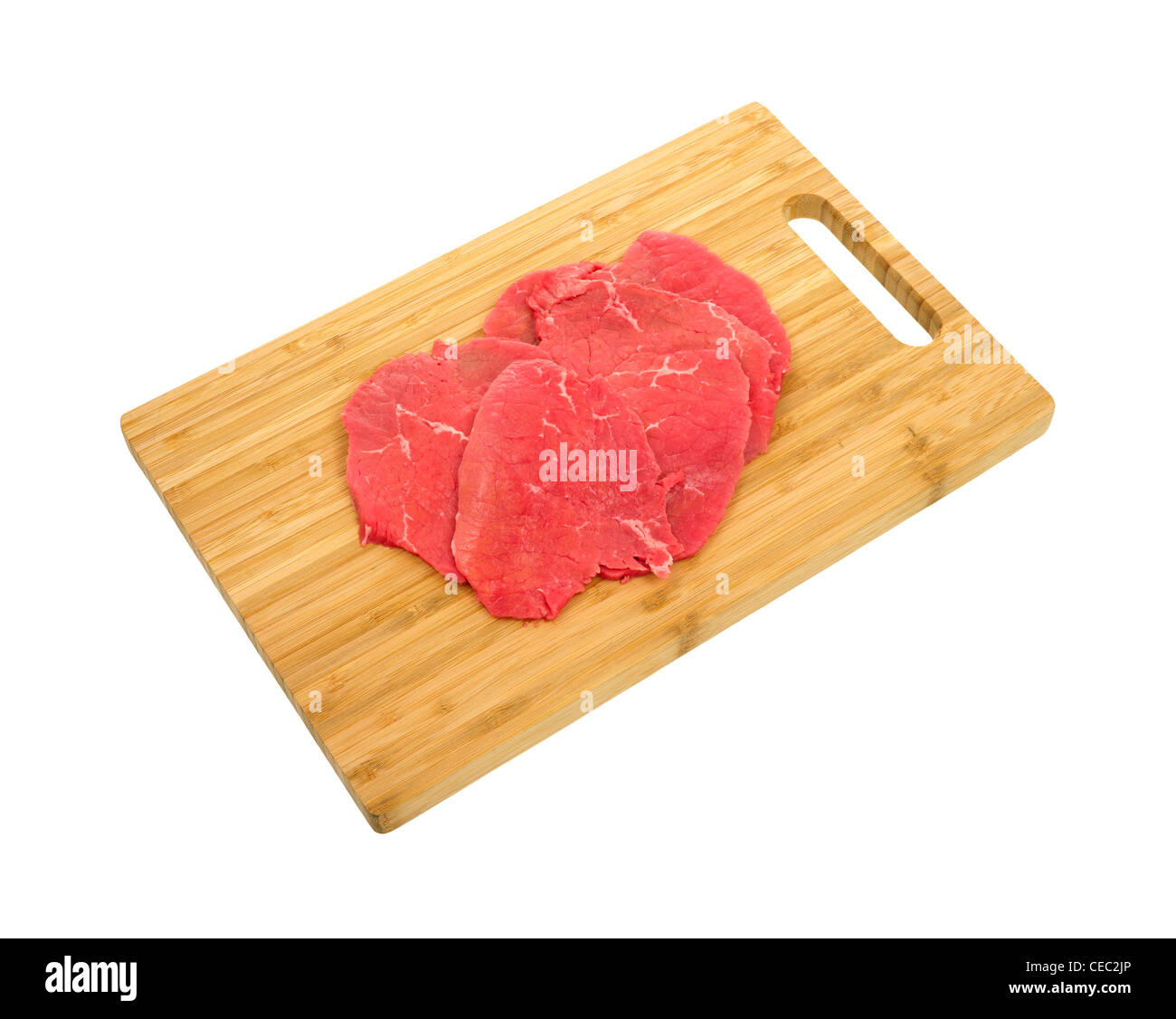 Beef eye round steak on wood cutting board Stock Photo