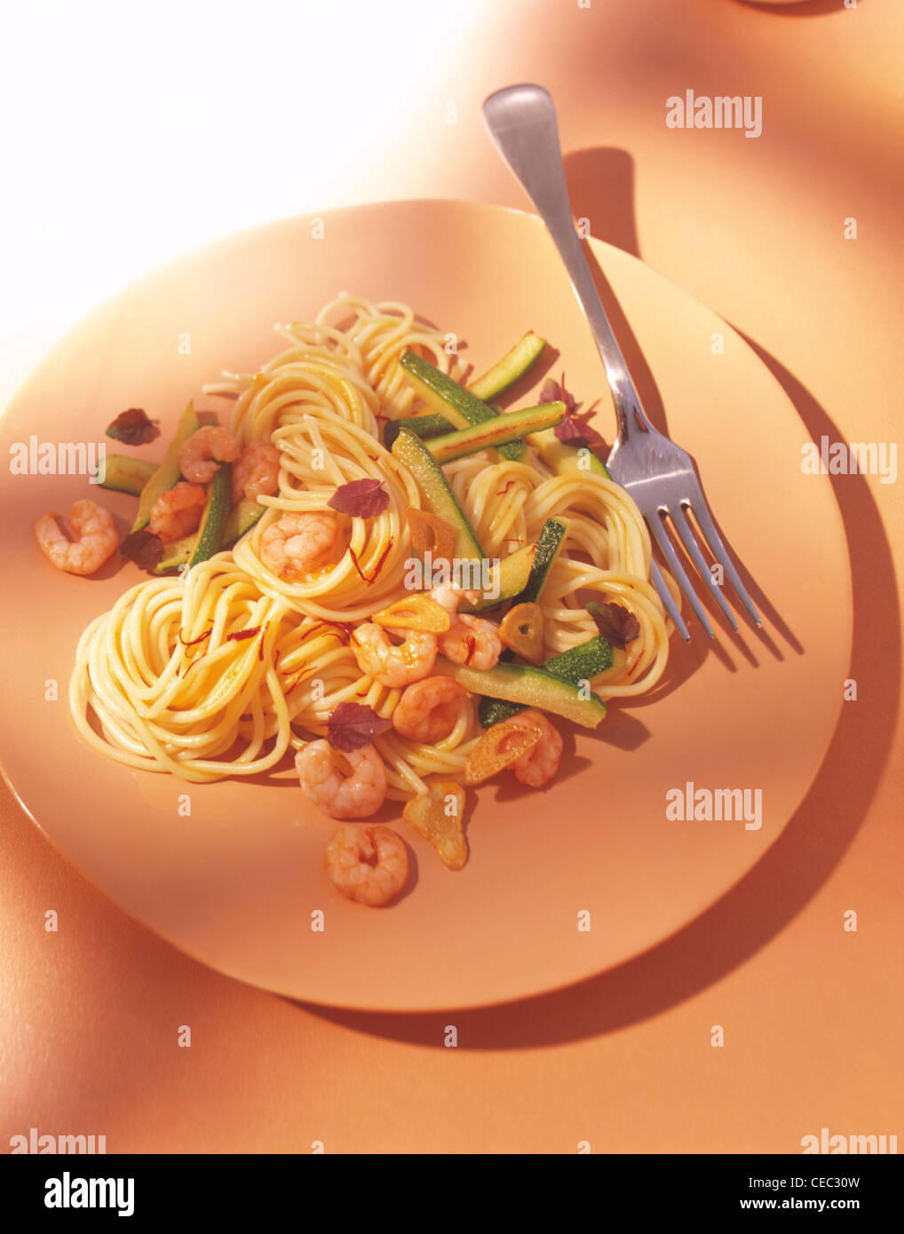 Spaghetti with saffron - shrimps (Spaghetti allo zafferano con gamberi) Stock Photo