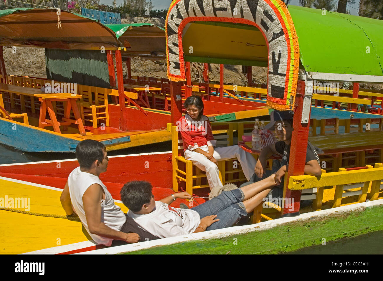 MEXICO, Xochimilco, people on traditional Mexican barges on the canal Stock Photo