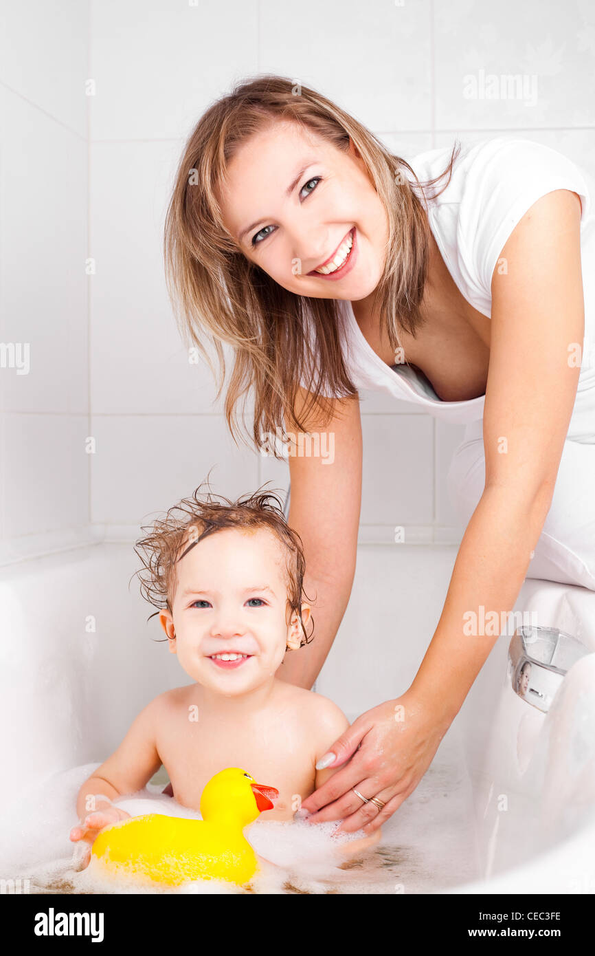 mother washing her baby in the bath Stock Photo Alamy