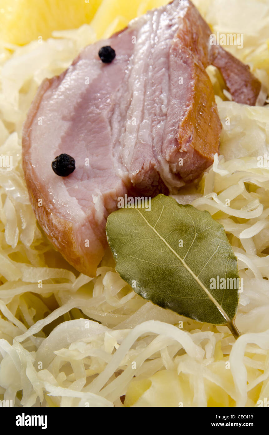 Steamed sauerkraut with smoked pork Stock Photo