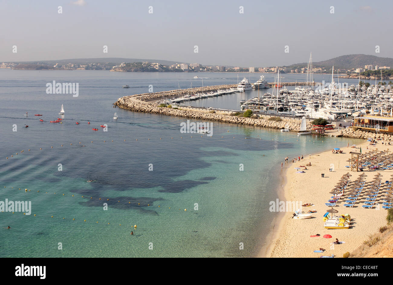 Scene looking westwards - with sailing school in operation - over Portals beach and Puerto Portals Marina,  Mallorca / Majorca Stock Photo