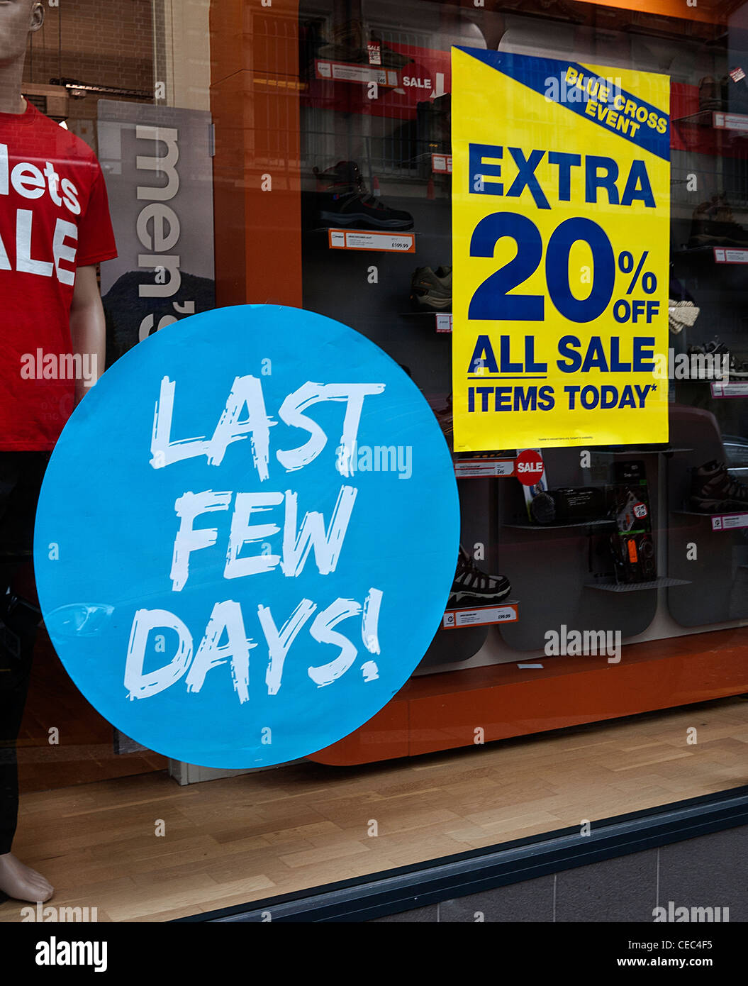 Retail Shop Window with Sale Stickers, UK. Stock Photo
